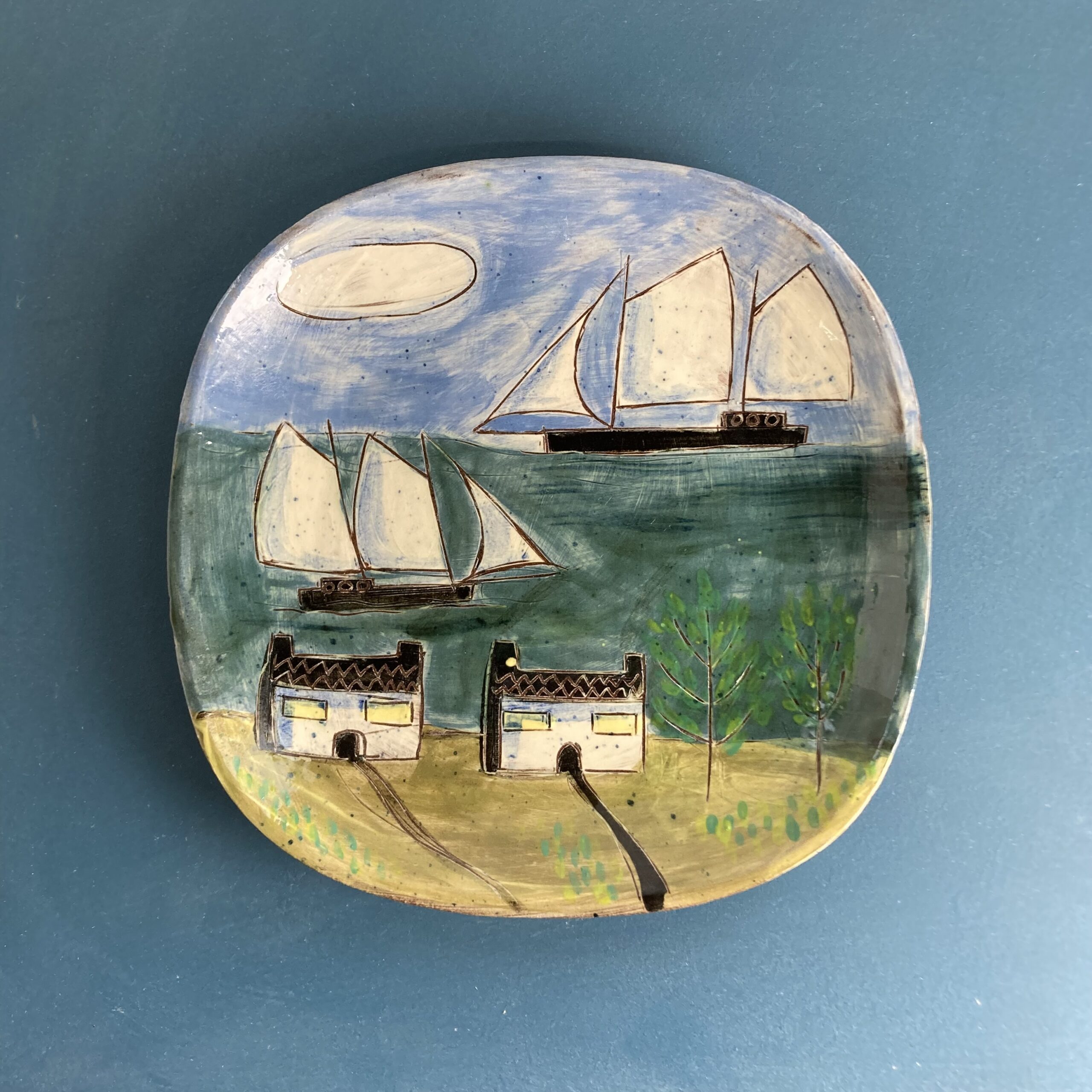 Two Cottages and Their Boats